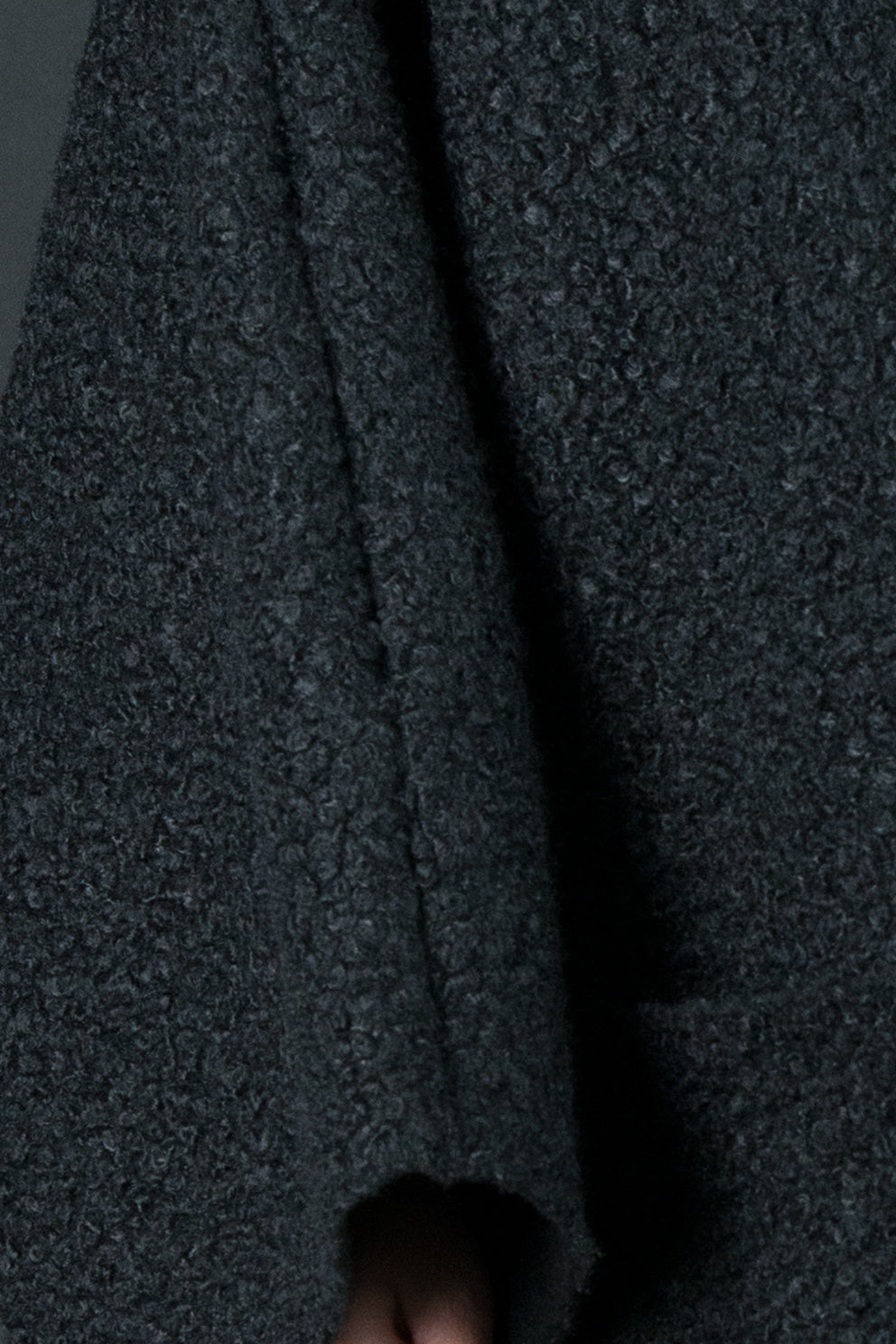 Black bouclé poncho with merino wool-like feel and two front pockets - wear as a top or outer layer, Magdalena | EUG Fashion #black
