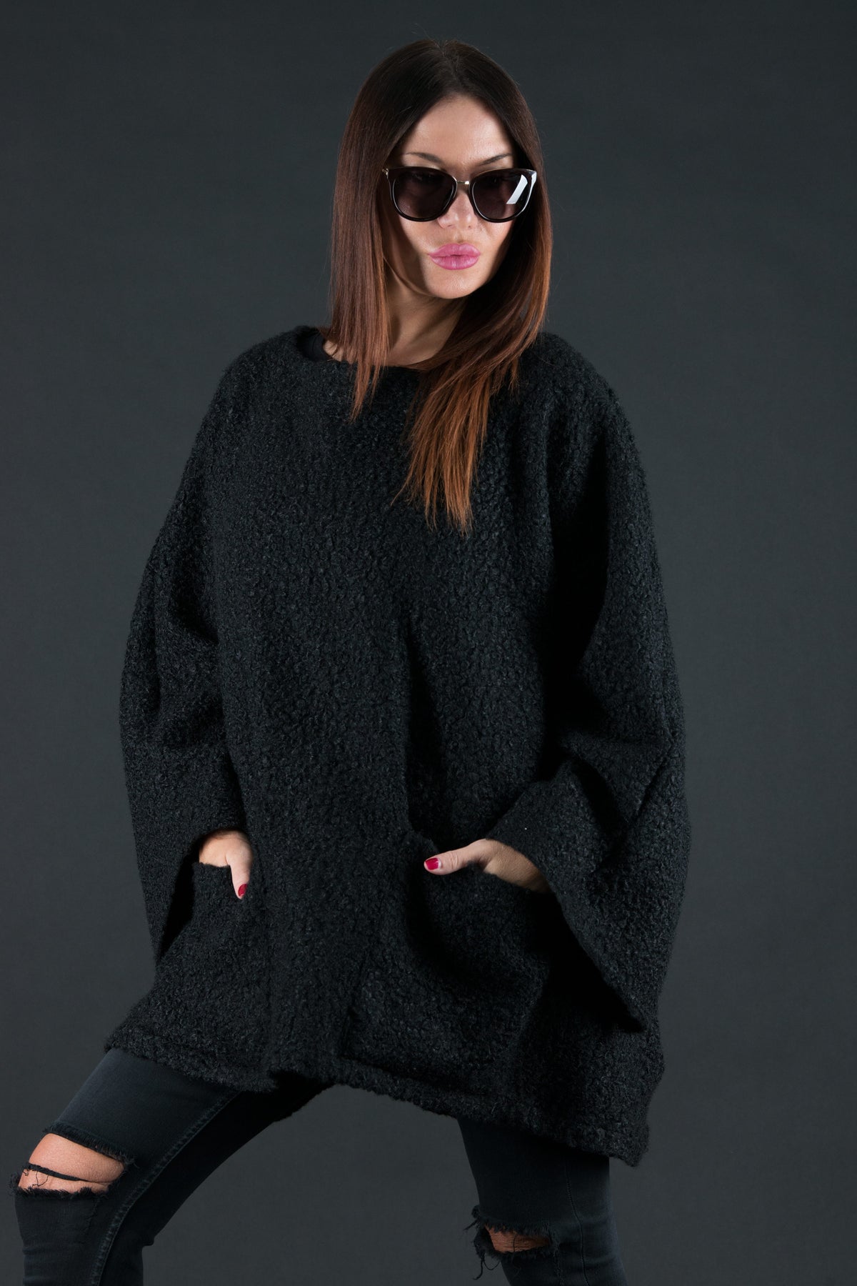 Black bouclé poncho with merino wool-like feel and two front pockets - wear as a top or outer layer, Magdalena | EUG Fashion #black
