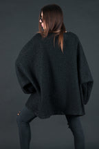 Black bouclé poncho with merino wool-like feel and two front pockets - wear as a top or outer layer, Magdalena | EUG Fashion #black
