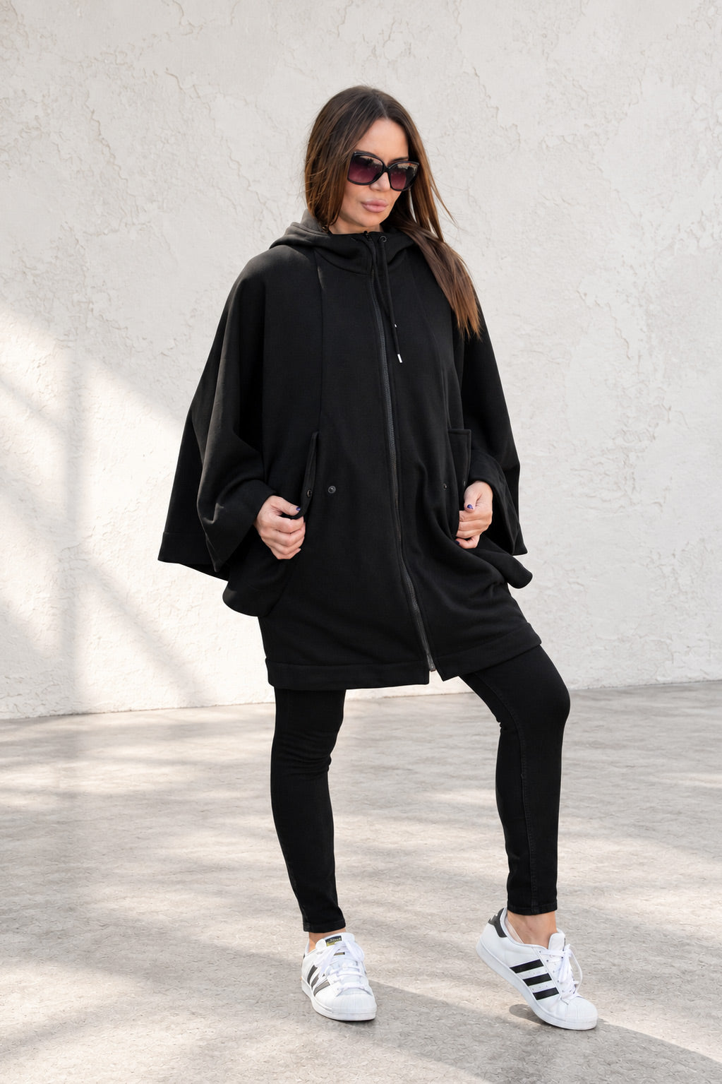 Black hooded poncho sweatshirt - batwing sleeves, snap-fastening pockets and Wild at Heart back print, Melody | EUG Fashion #black