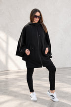 Black hooded poncho sweatshirt - batwing sleeves, snap-fastening pockets and Wild at Heart back print, Melody | EUG Fashion #black