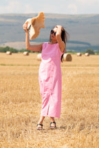 Woman in a pink linen dress 