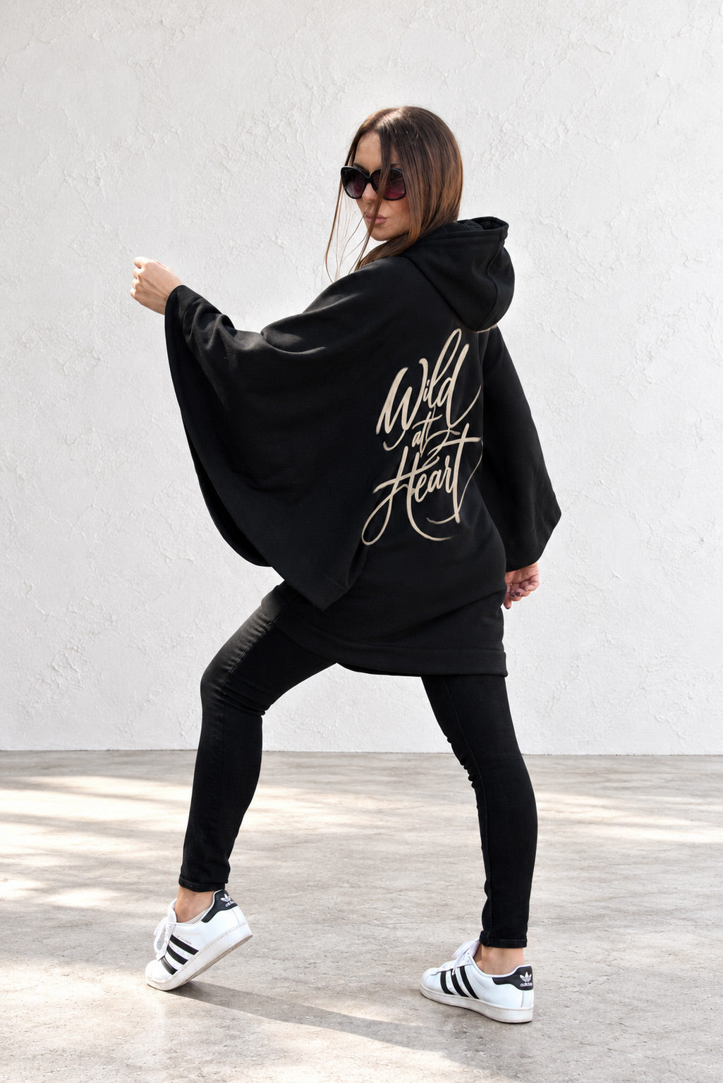 Black hooded poncho sweatshirt - batwing sleeves, snap-fastening pockets and Wild at Heart back print, Melody | EUG Fashion #black