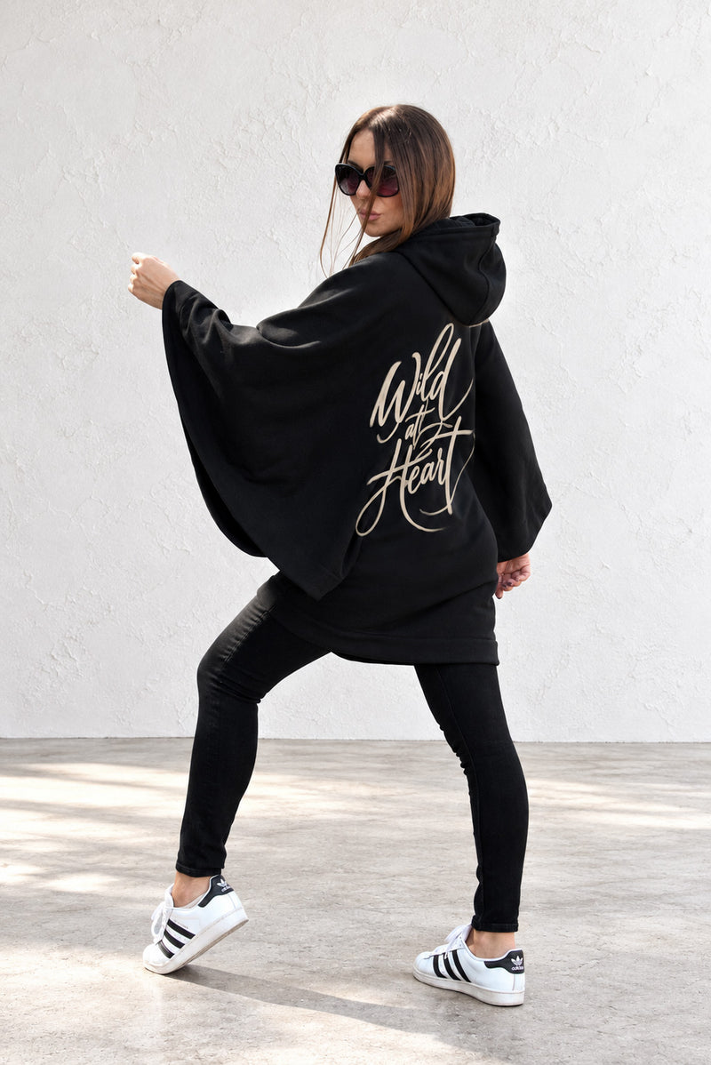 Black hooded poncho sweatshirt - batwing sleeves, snap-fastening pockets and Wild at Heart back print, Melody | EUG Fashion #black