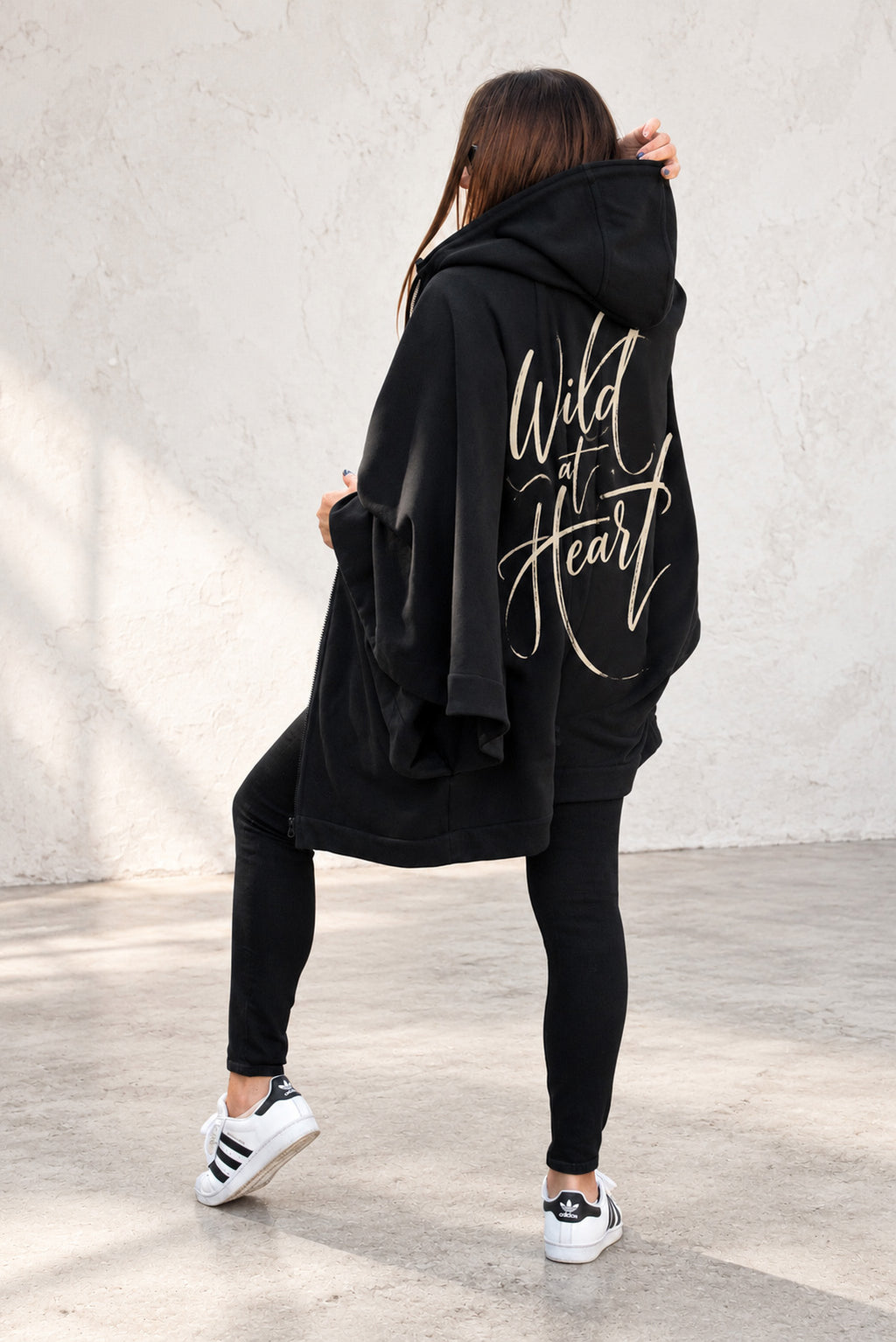 Black hooded poncho sweatshirt - batwing sleeves, snap-fastening pockets and Wild at Heart back print, Melody | EUG Fashion #black