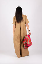 Woman in a long beige jumpsuit - EUG fashion