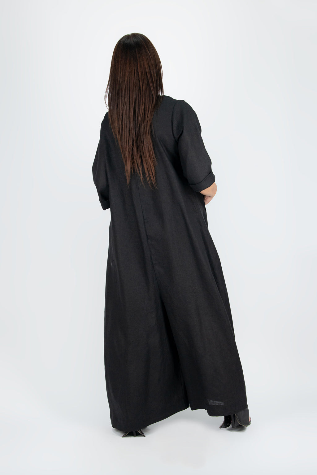 Person wearing a long black jumpsuit - EUG fashion