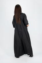 Person wearing a long black jumpsuit - EUG fashion