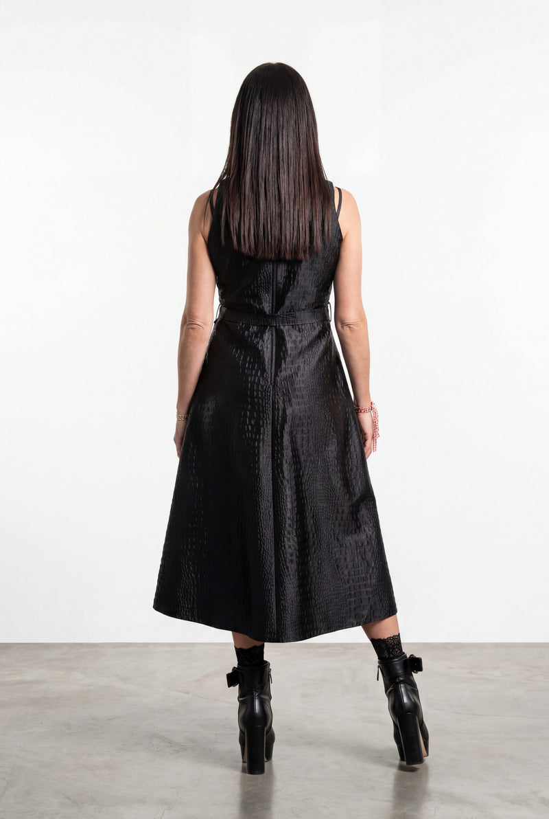 Woman wearing a black dress with a white background