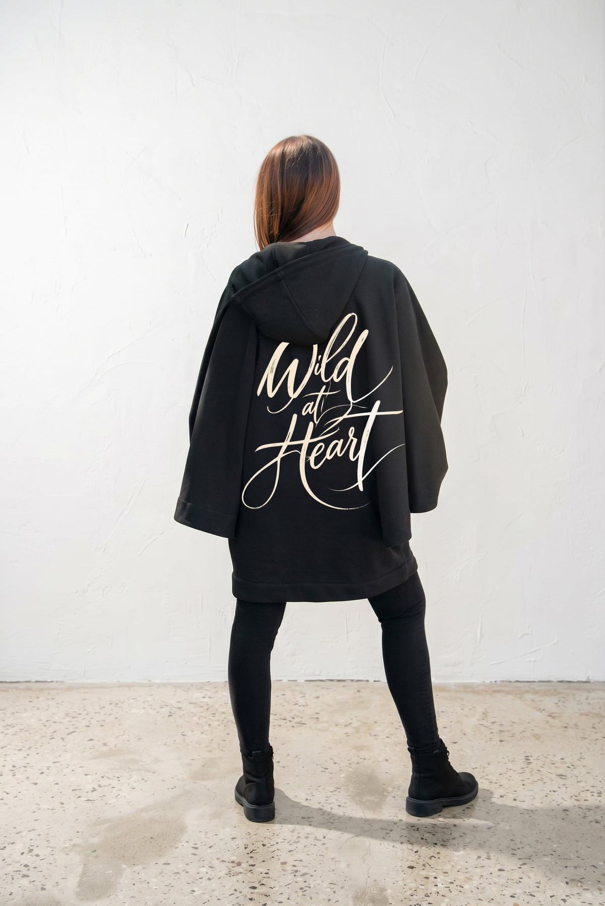 Black hooded poncho sweatshirt - batwing sleeves, snap-fastening pockets and Wild at Heart back print, Melody | EUG Fashion #black