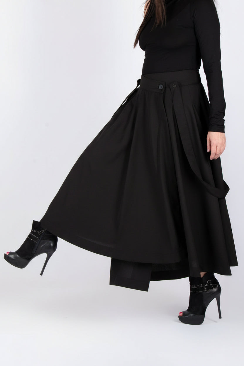 Person wearing a black dress with a white background