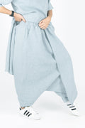Light blue linen pants with a white background