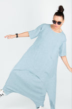 Woman wearing a light blue set on a white background