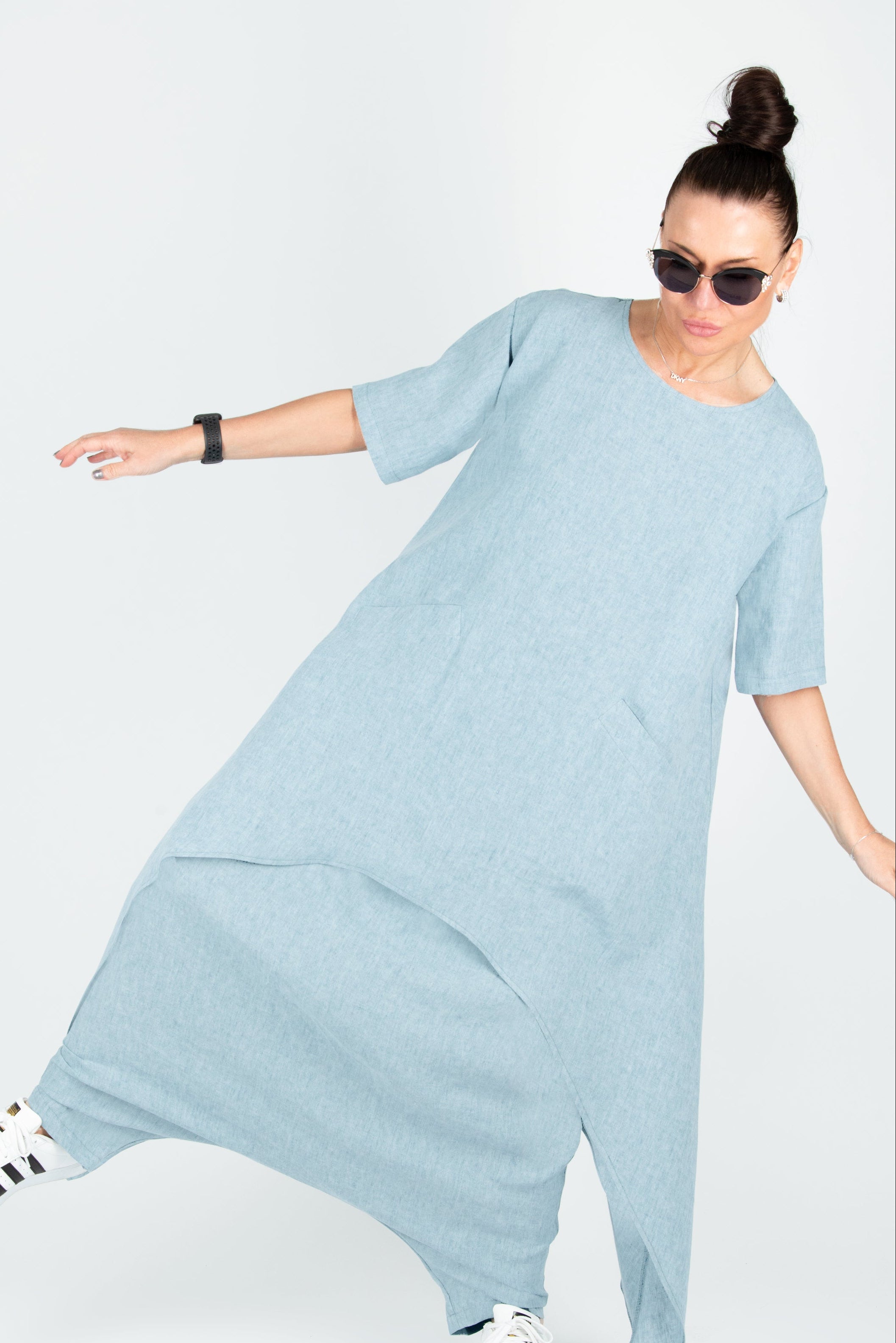 Woman wearing a light blue set on a white background