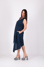 Woman wearing a navy blue dress with a white background