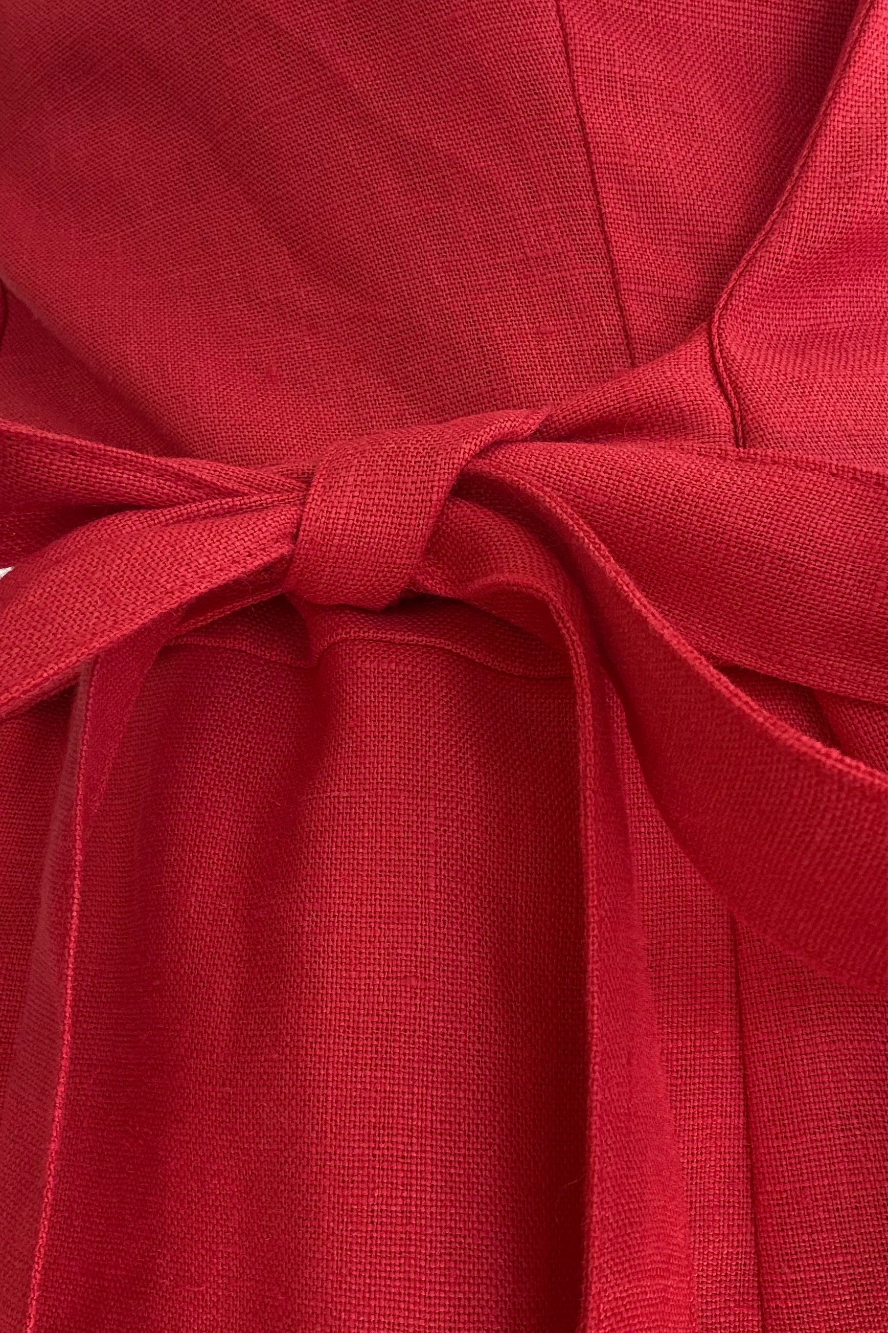 Close-up of a red fabric with a tie detail