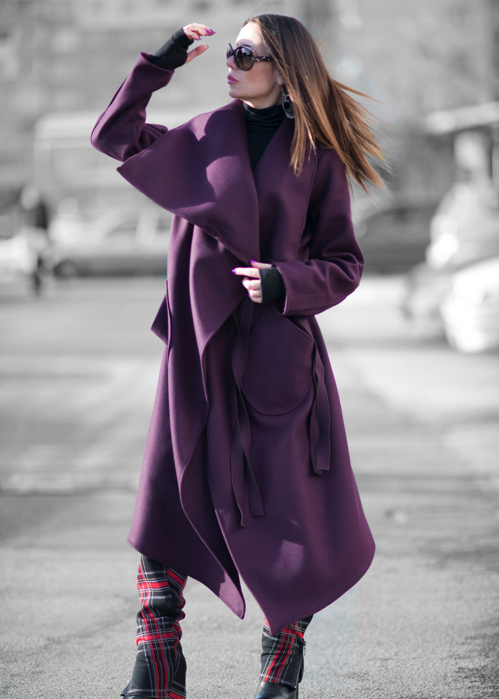 Woman wearing a purple coat on a street