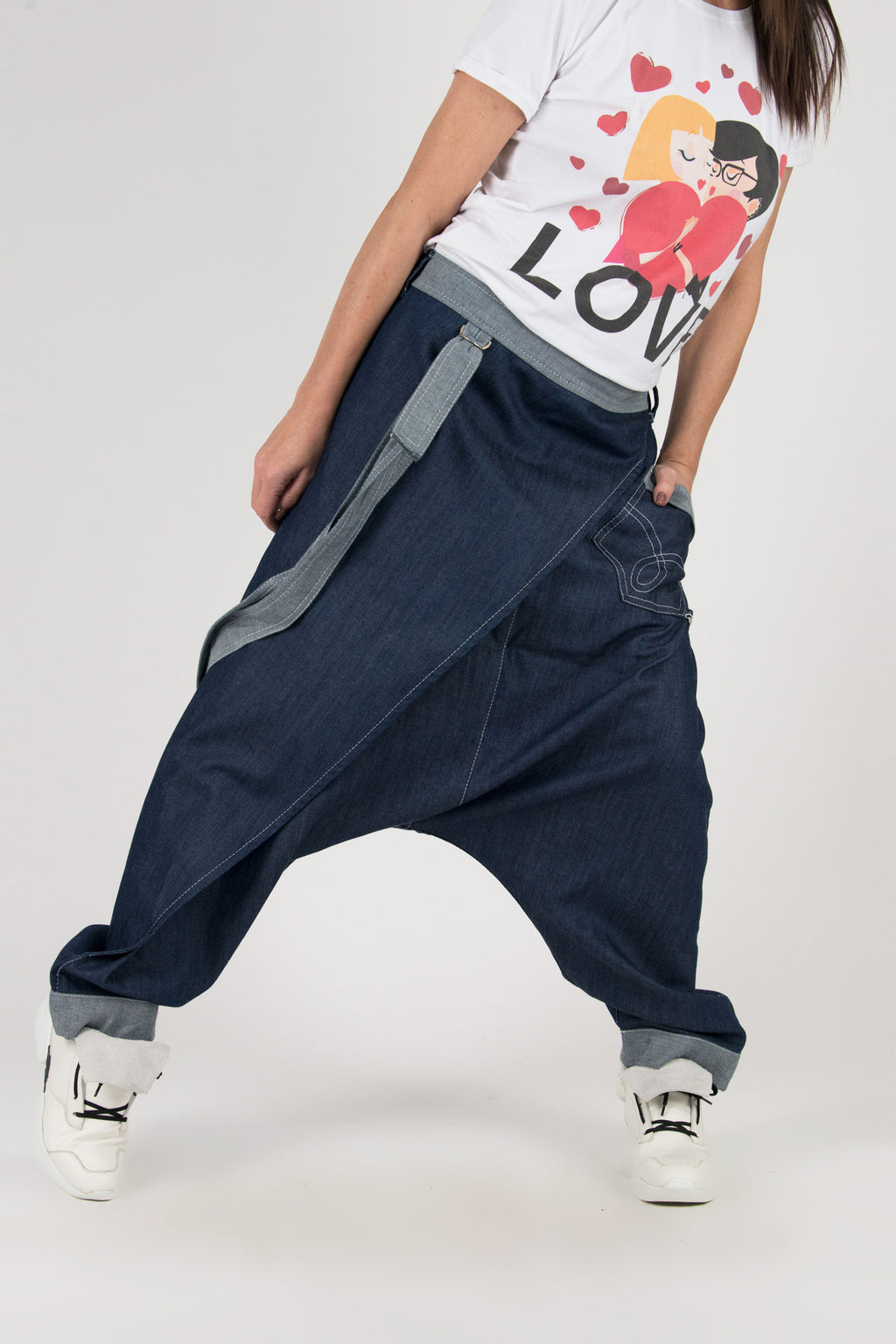 Dark blue jeans drop-crotch pants Lesila — drop crotch silhouette and suspenders detail, studio

