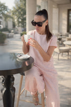 Woman in a pink jumpsuit - EUG fashion