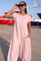 Woman in a pink jumpsuit  EUG fashion