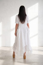 Woman in a white linen dress  - eug fashion