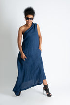Woman wearing a blue one-shoulder dress on a white background