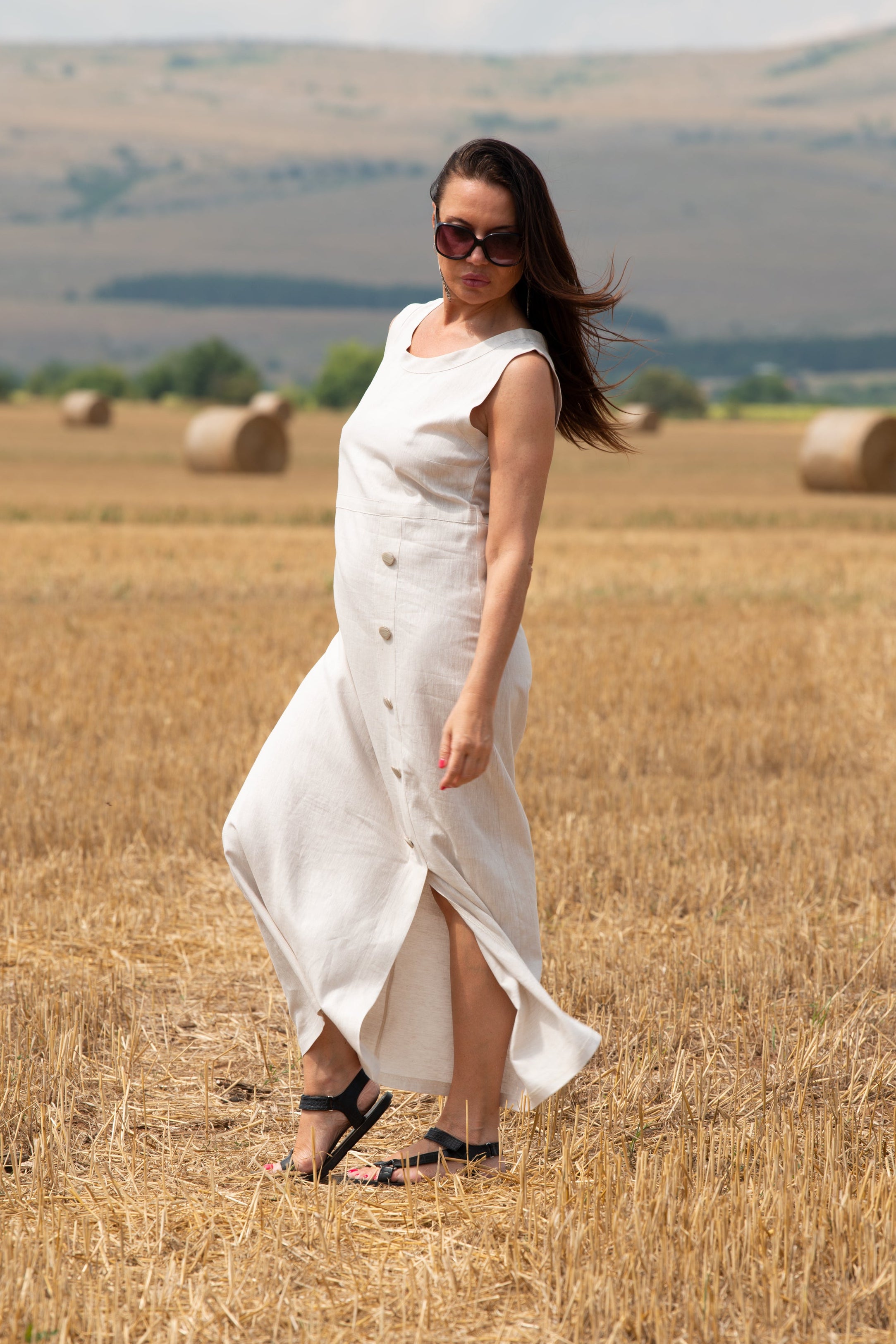 Woman in a white linen dress  Eug fashion