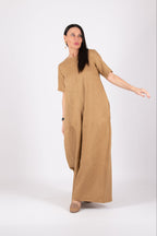 Woman wearing a long beige jumpsuit - Eug fashion 