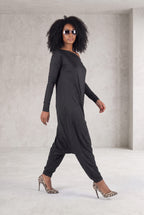 Black jersey harem jumpsuit - boat neckline, fitted sleeves and loose draped silhouette with tapered legs, Marla | EUG Fashion