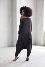 Black jersey harem jumpsuit - boat neckline, fitted sleeves and loose draped silhouette with tapered legs, Marla | EUG Fashion