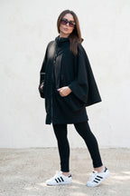 Black hooded poncho sweatshirt - batwing sleeves, snap-fastening pockets and Wild at Heart back print, Melody | EUG Fashion #black