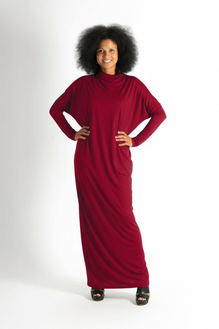 Woman wearing a long red dress on a white background