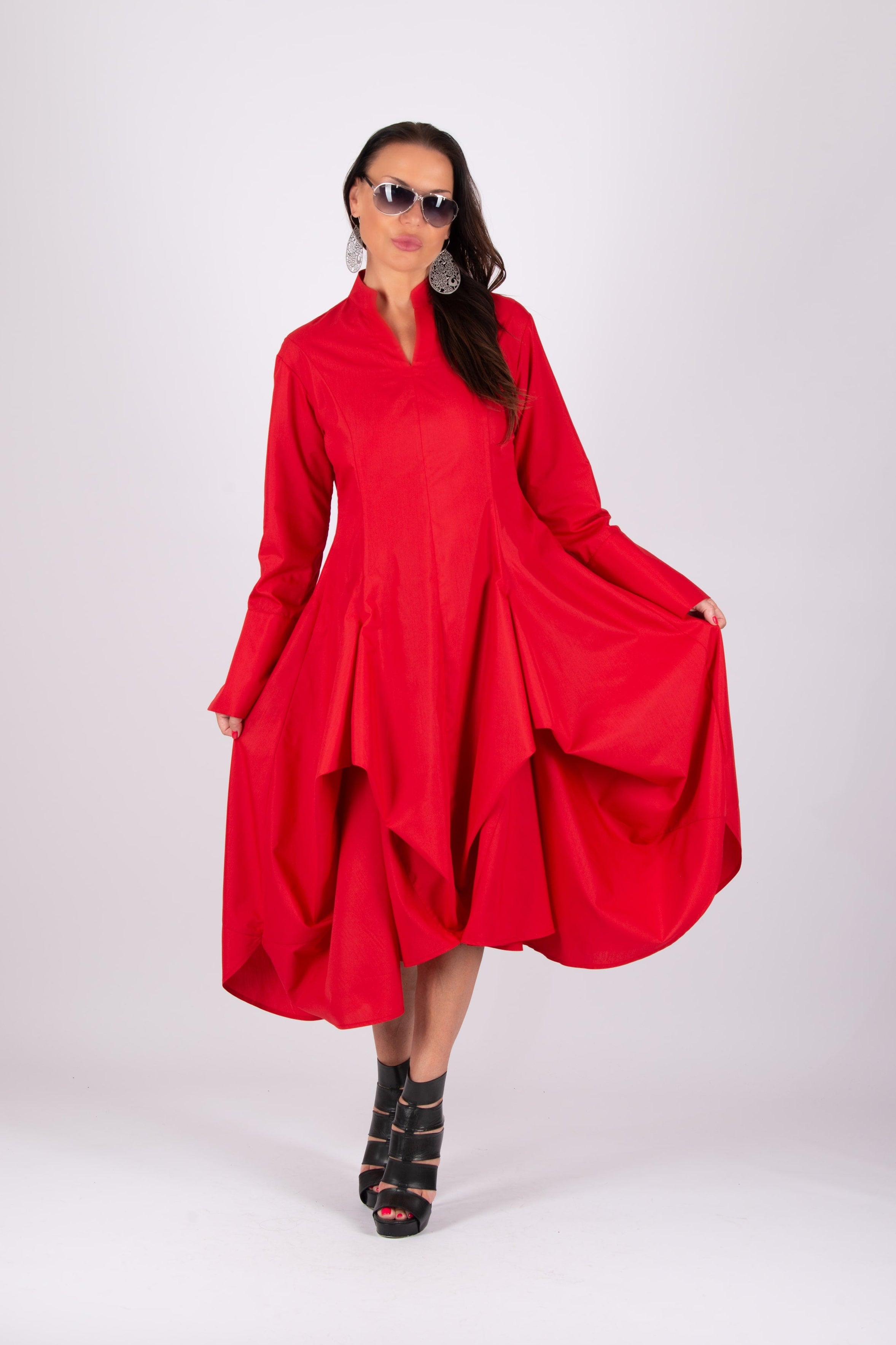 Woman wearing a red dress on a white background