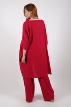 Woman wearing a red outfit on a white background