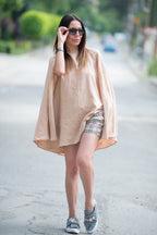 Woman wearing a beige linen oversized dress - EUG fashion