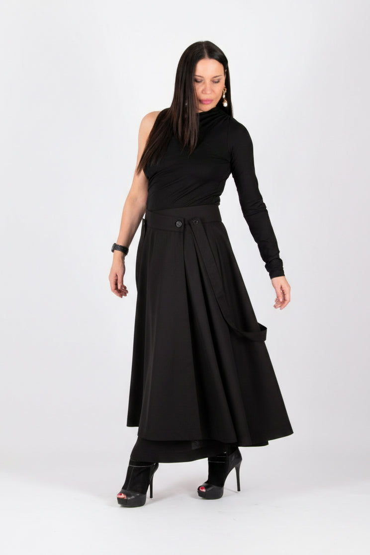 Woman wearing a black dress with a white background