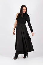 Woman wearing a black dress with a white background