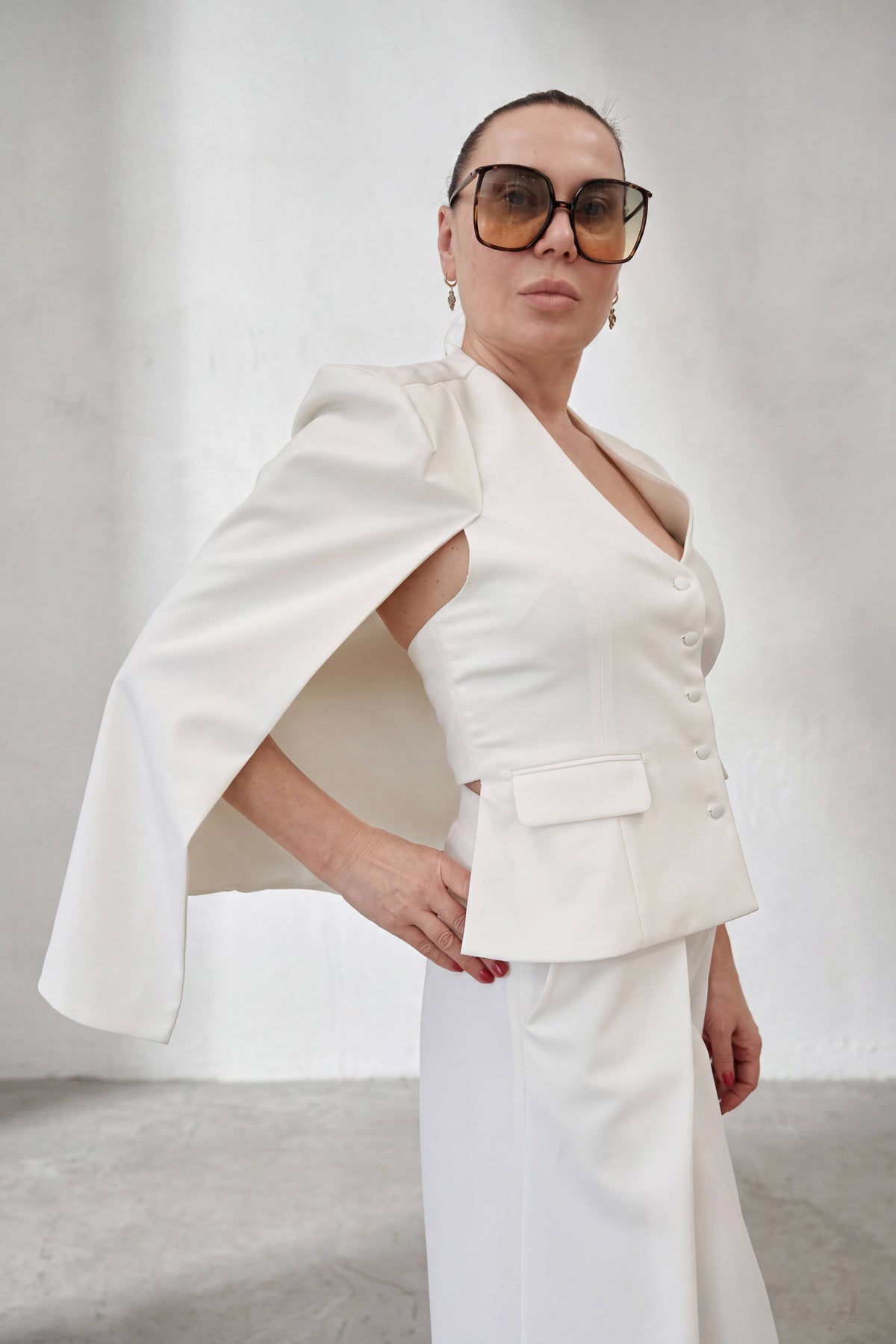 White cape blazer with fitted vest front, V-neckline and button closure - elegant cape panels from shoulders, Oslo | EUG Fashion #white