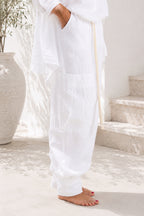 Person wearing a white linen outfit pants
