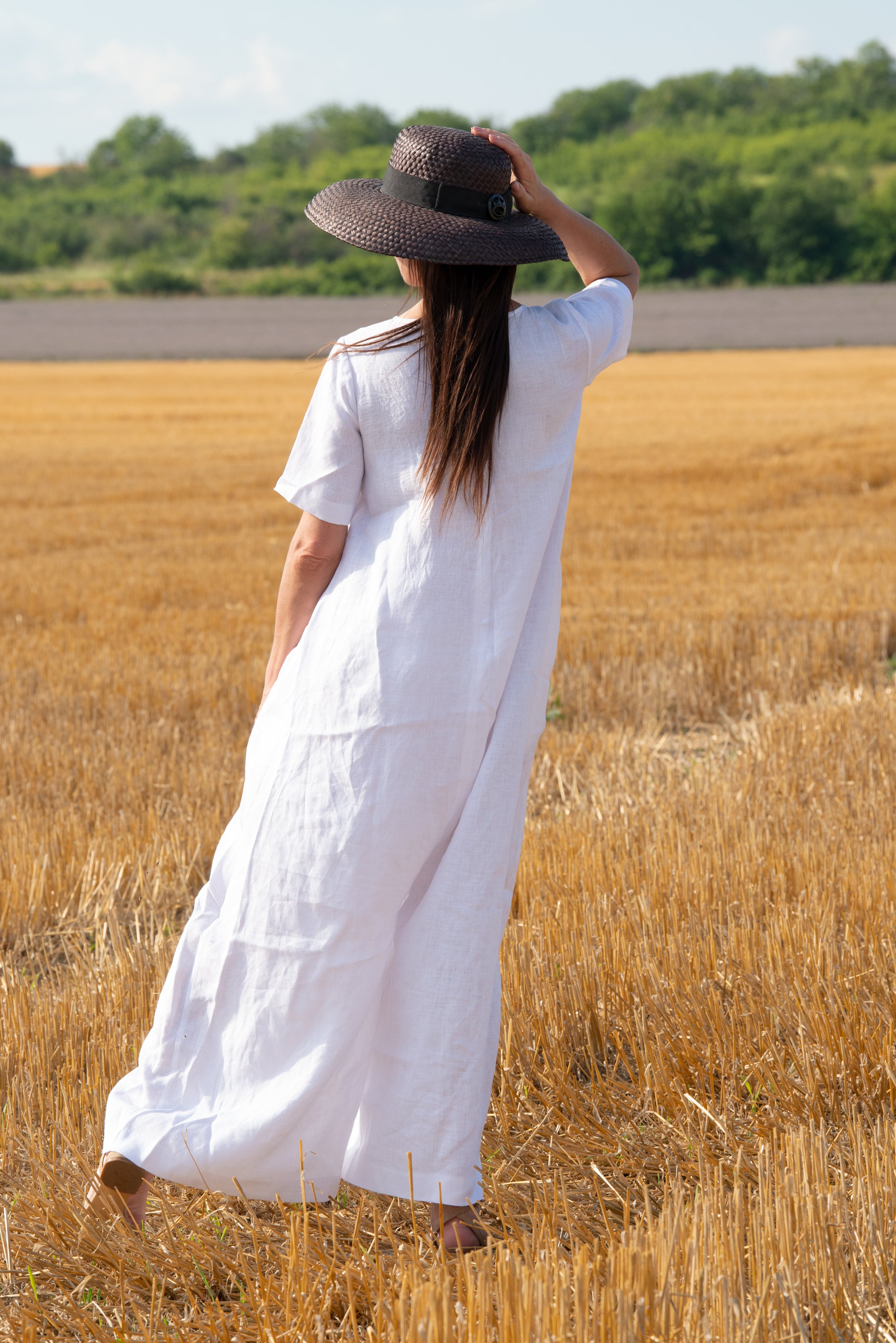 Woman in a white jumpsuit loose fit - eug fashion 