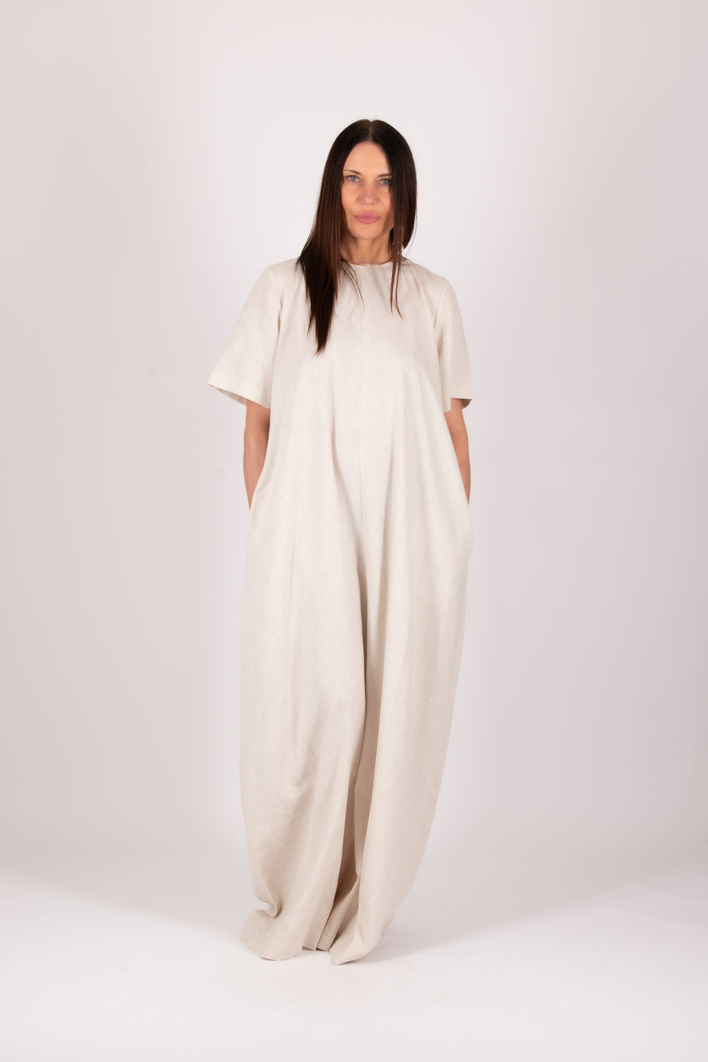 Woman wearing a beige jumpsuit