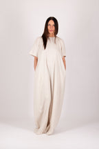 Woman wearing a beige jumpsuit