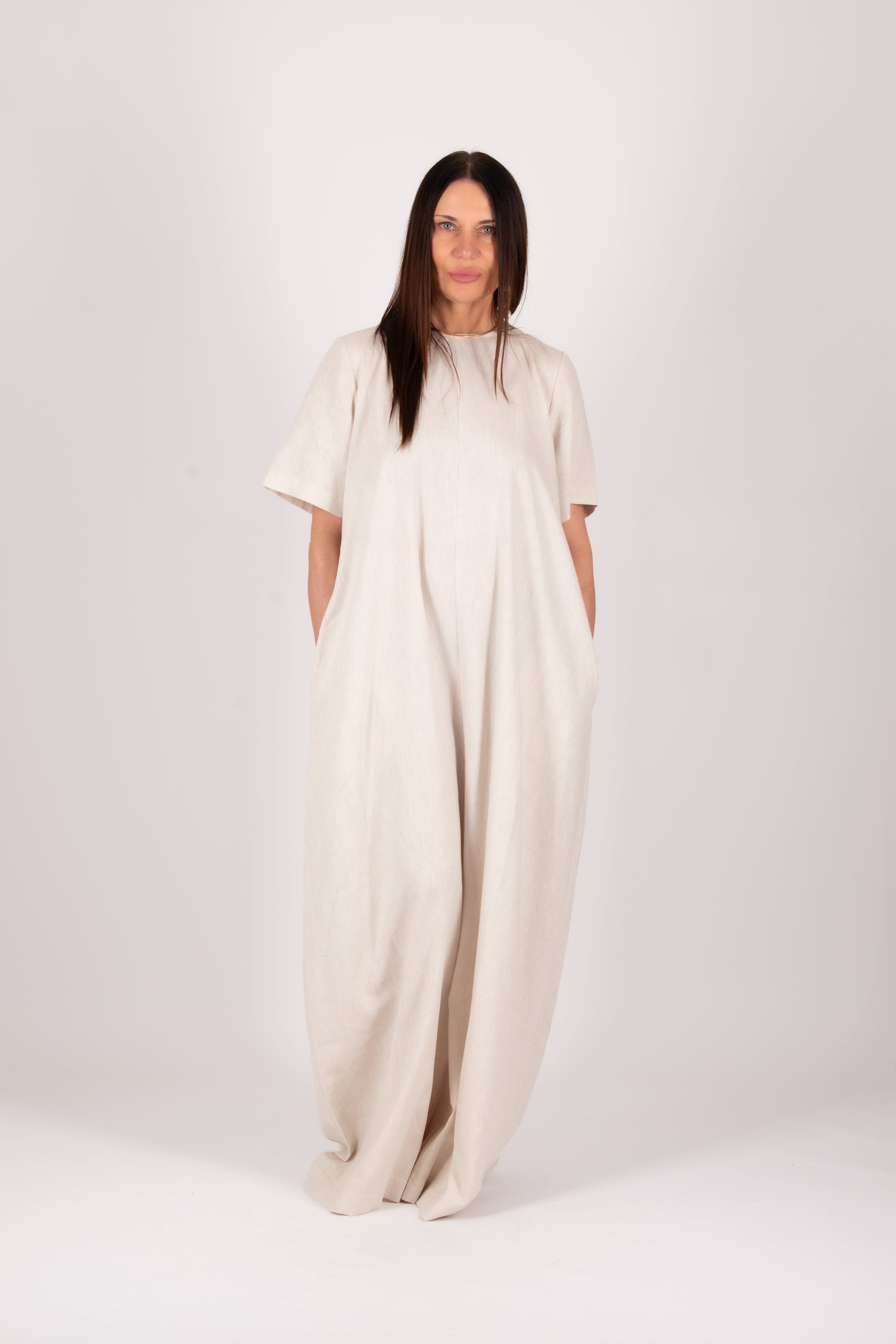 Woman wearing a beige jumpsuit