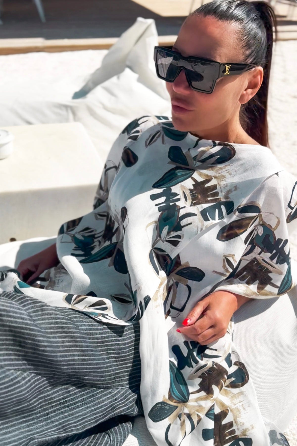 Woman wearing a floral top  - EUG fashion