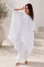 Woman wearing a white linen outfit  from eug fashion